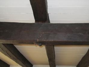 Cracked main girder in post and beam ceiling in old farmhouse Harrison NY
